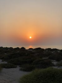 Scenic view of landscape against sky during sunset