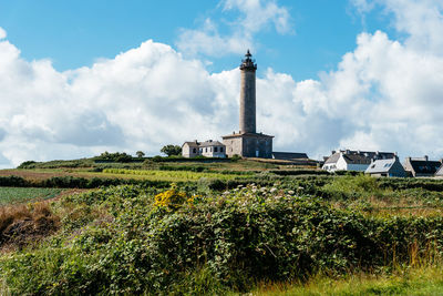 View of the island of batz and the lighthouse a sunny day of summer