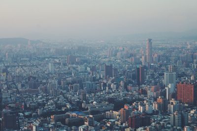 Aerial view of cityscape against sky