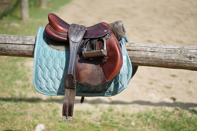 Close-up of clothes sitting on seat in field