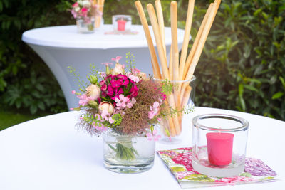 Close-up of pink flower vase on table