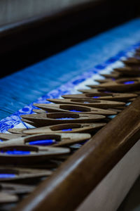 Close-up of metal grate on table