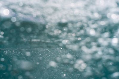 Defocused image of people in water