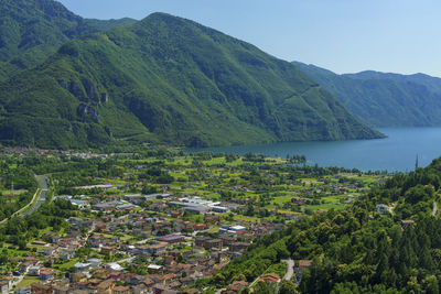 Scenic view of sea and mountains against sky