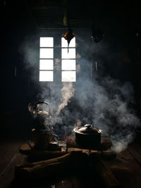 Man preparing food on table at window