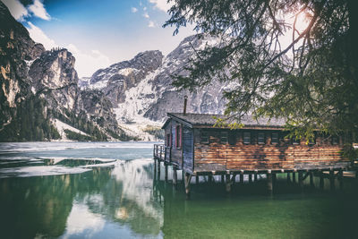 Scenic view of lake by trees against sky