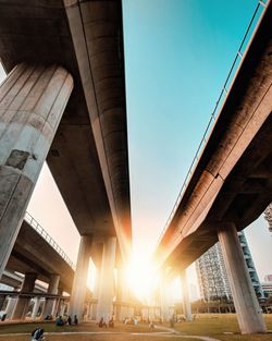 Low angle view of bridges against sky in city