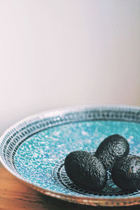 High angle view of blue bowl on table