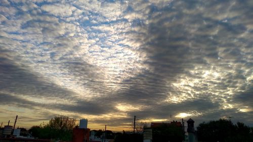 Low angle view of silhouette buildings against sky during sunset