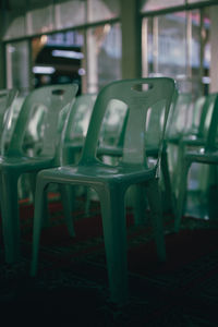 Close-up of empty chairs and table