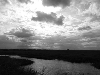 View of calm sea against cloudy sky