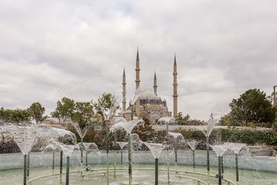 Fountain with building in background