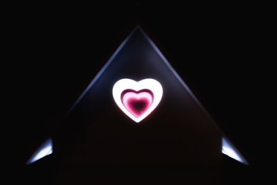 Close-up of heart shape over black background