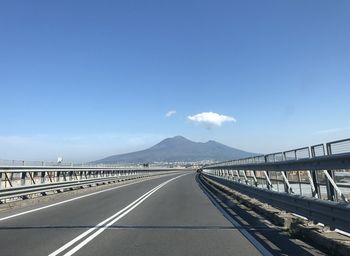 Empty road against clear sky