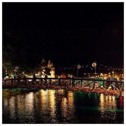 Bridge over river at night