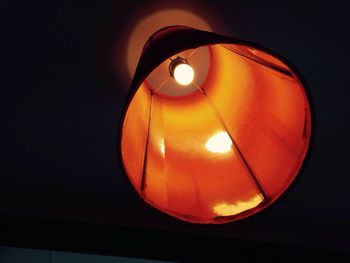 Low angle view of illuminated electric light bulb