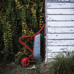 Construction pushcart leaning on the back of a old house