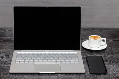 Close-up of coffee cup on table