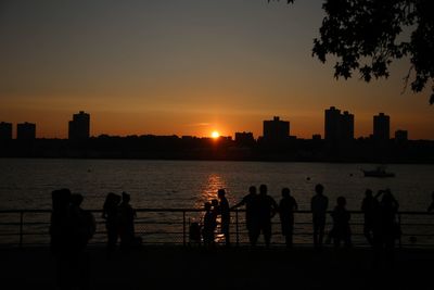 Scenic view of river at sunset