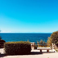 Scenic view of sea against clear blue sky