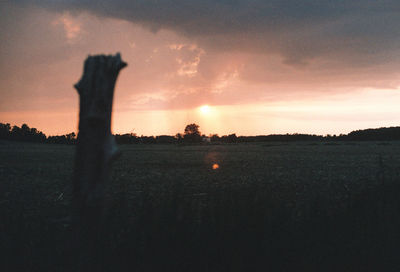 Silhouette landscape against sky during sunset