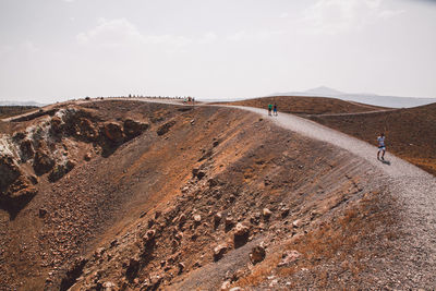 Scenic view of mountains at desert against sky