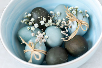 Colored easter eggs in a bowl, closeup. festive decoration.