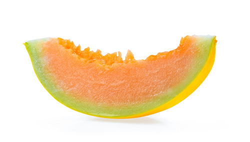 Close-up of orange slice against white background