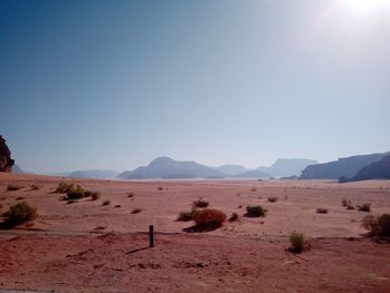 Scenic view of arid landscape against clear sky