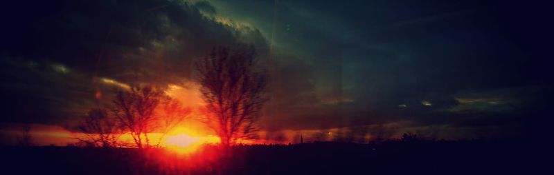 Scenic view of silhouette landscape against sky during sunset