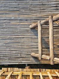 High angle view of wooden logs against wall