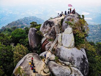 High angle view of people on rock