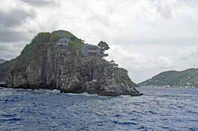 Scenic view of sea and mountains against sky