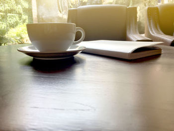 Close-up of coffee cup on table