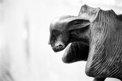 Close-up of horse statue against sky