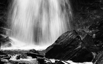 Close-up of waterfall against rocks