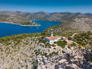 Scenic view of mountains against blue sky