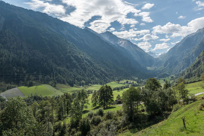 Scenic view of landscape and mountains against sky