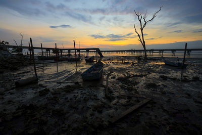 Scenic view of beach against sky during sunset