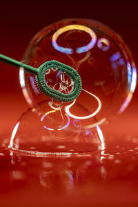 Soap bubble on red background