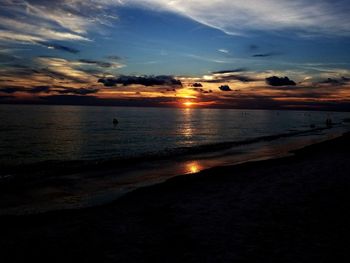 Scenic view of beach against sky during sunset