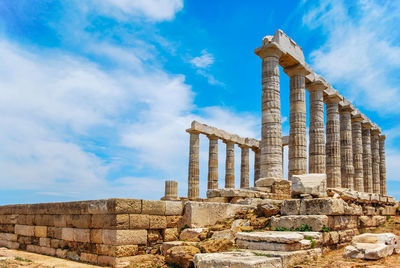 Old ruins of temple against cloudy sky