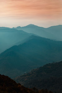 Scenic view of mountains against sky during sunset