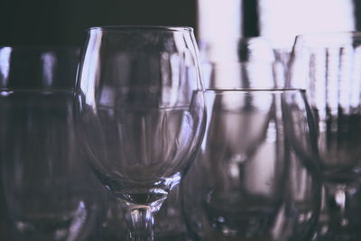 Close-up of wine glasses on table