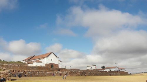 Panoramic view of houses and buildings against sky