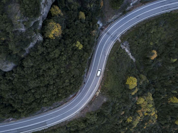 Van on a windy road in the mountains