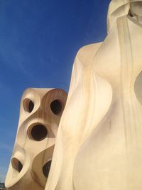 Low angle view of built structure against blue sky