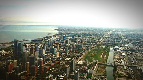 High angle view of cityscape against sea