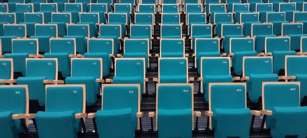 Rows of empty chairs in stadium