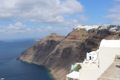 Scenic view of sea and buildings against sky